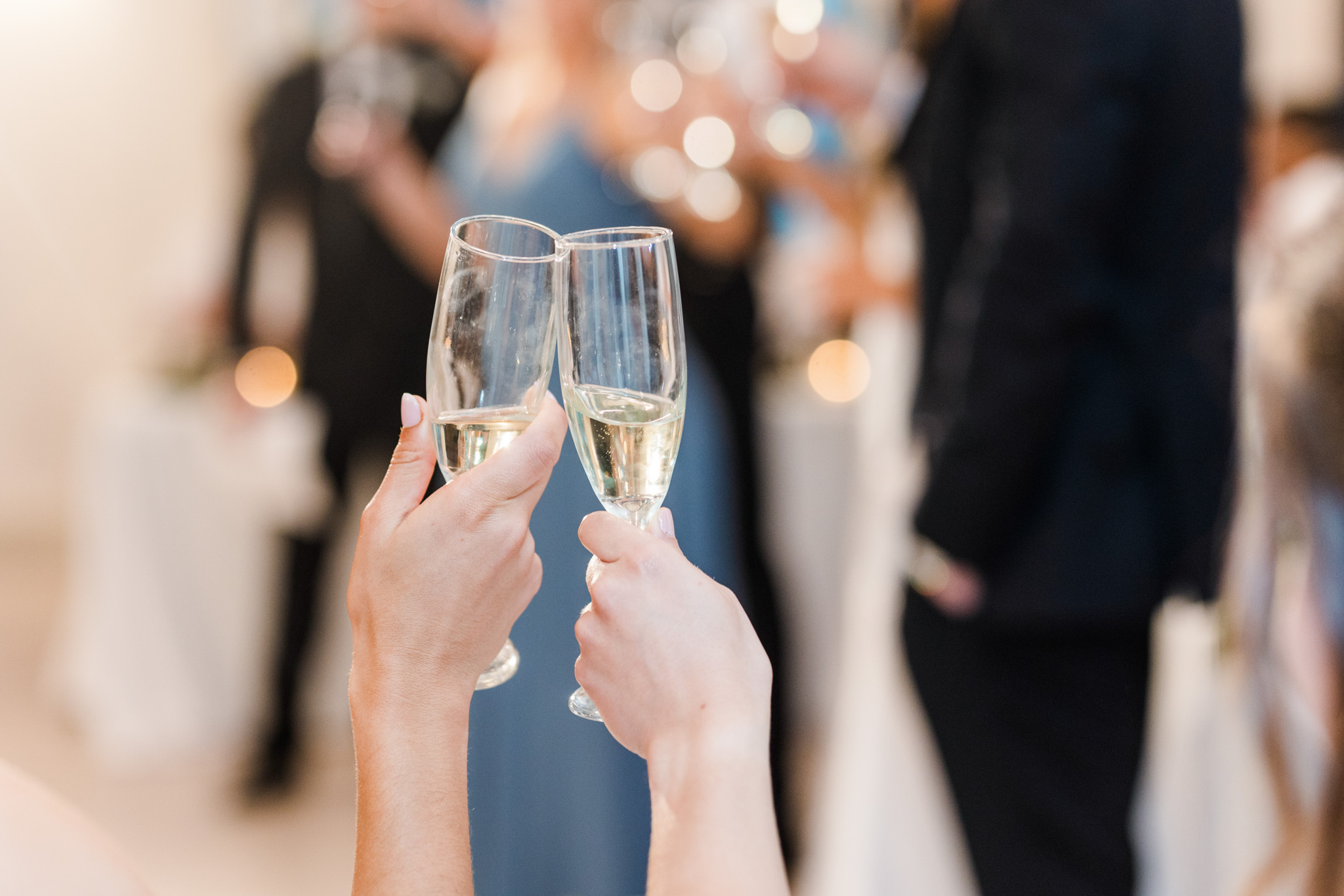 Toasting champagne glasses glasses at a wedding